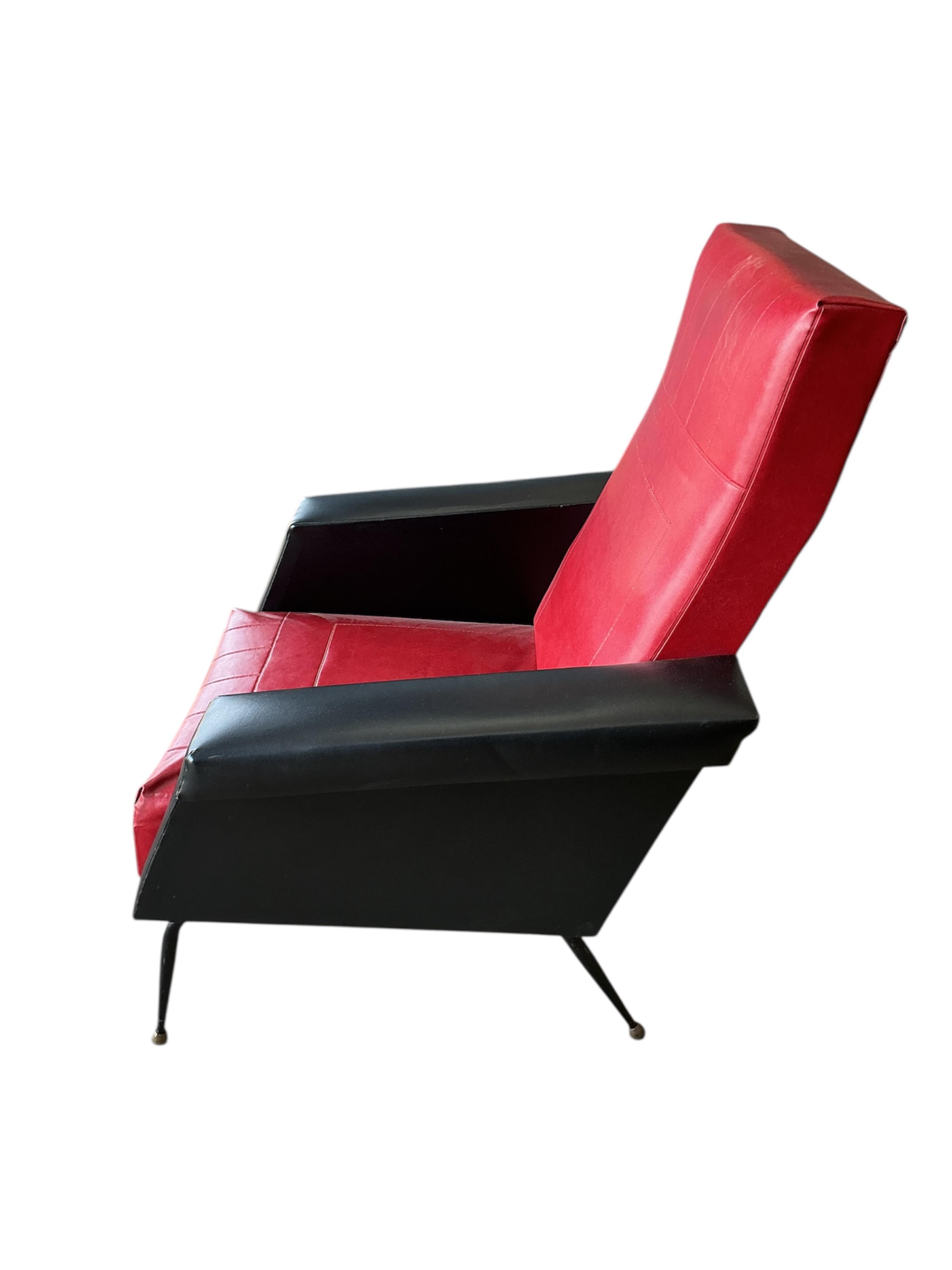 A pair of 1970's leatherette armchairs, width 74cm, depth 78cm, height 93cm
